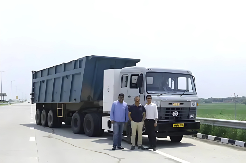Subodh, Chetan, and Siddhartha from IPLT with their Rhino 5536 electric truck in Faridabad.