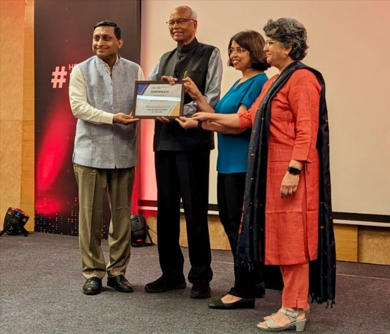 Serigen Mediproducts founders receiving the Healthtech Startup of the Year award at HTG Pune Summit 2024.
